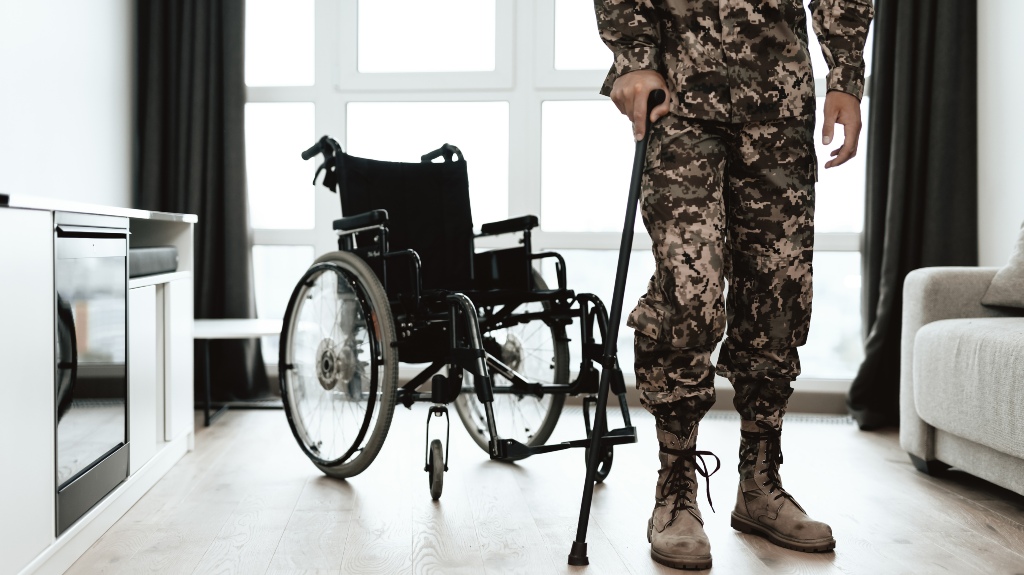 soldier is leaning on a crutch